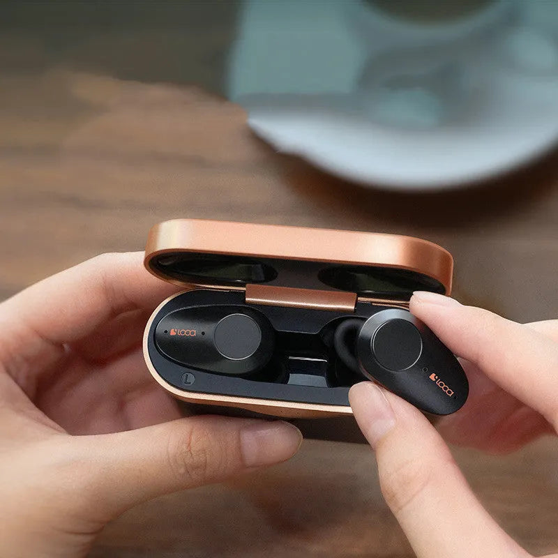 Black wireless Bluetooth headphones with ANC and a charging stand featuring type-C and wireless charging