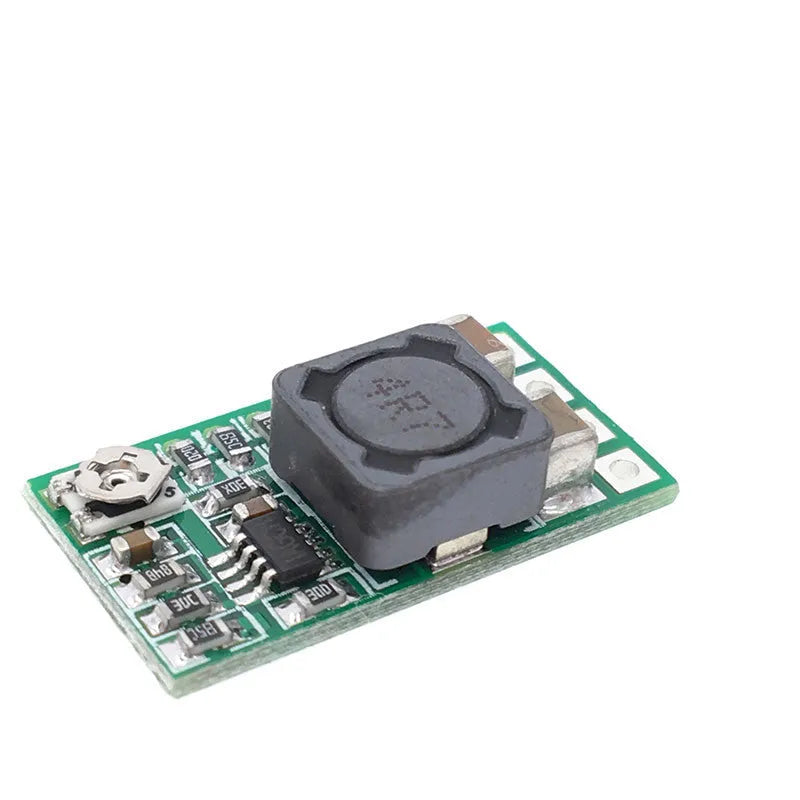 Green 25x21mm DC-DC buck converter module for 12-24V to 5V conversion