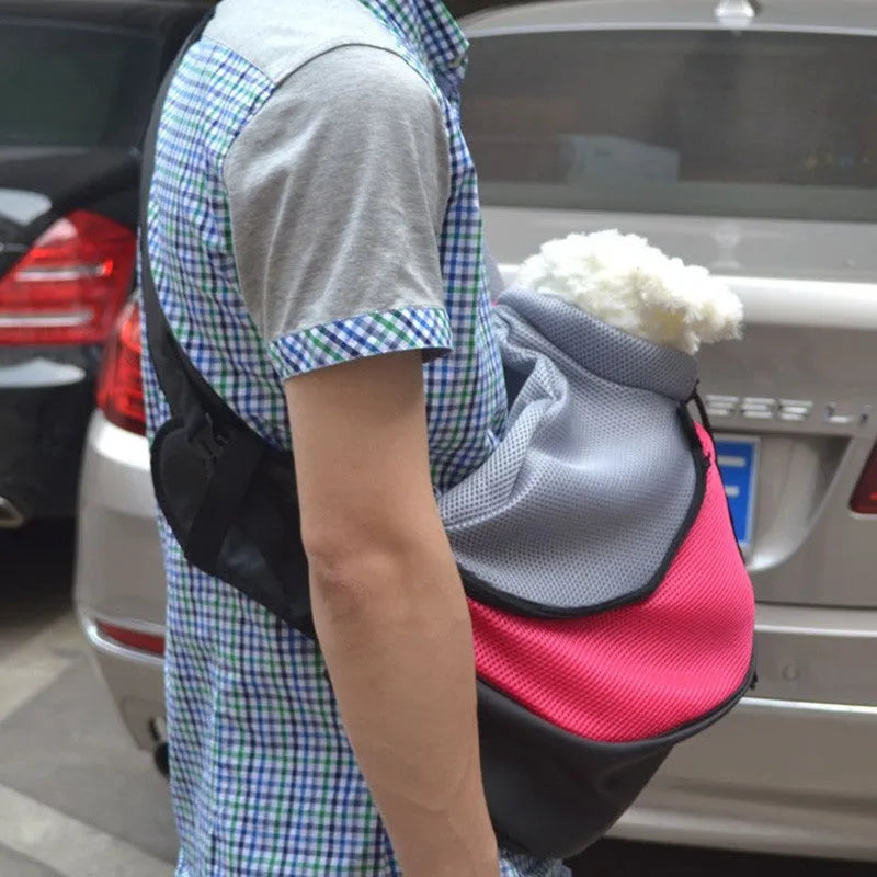 Blue polyester pet carrier backpack for small dogs, shown with adjustable straps and ventilation.