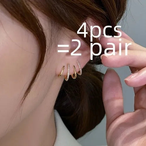 Pair of S925 silver needle four-prong zircon inlaid geometric stud earrings in gold finish