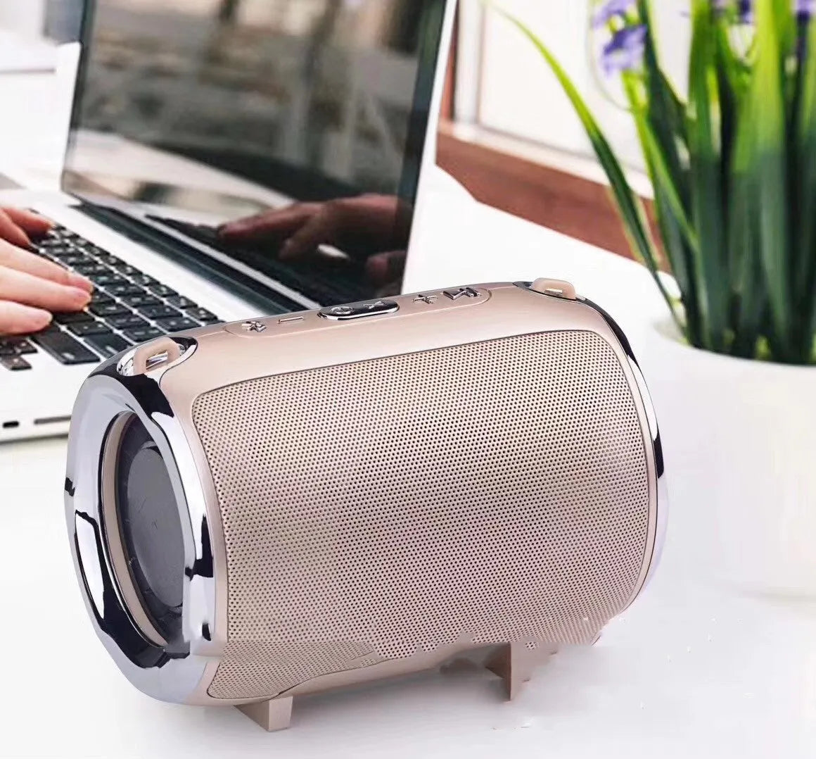 Portable Bluetooth subwoofer speaker in metal casing with USB and SD card slots for playback