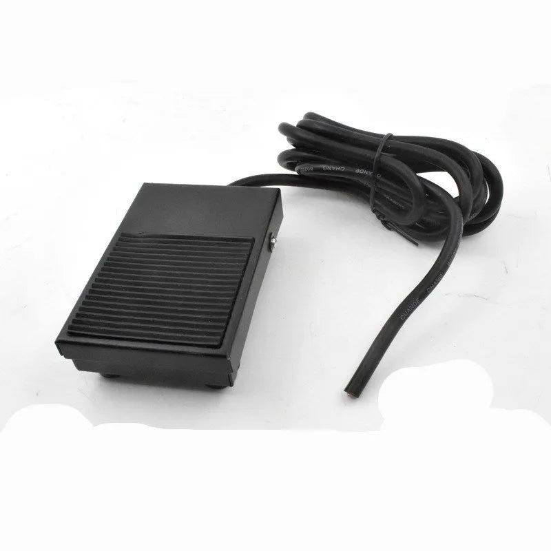 Metal welding machine foot switch with rubber pedals and a long black cable.