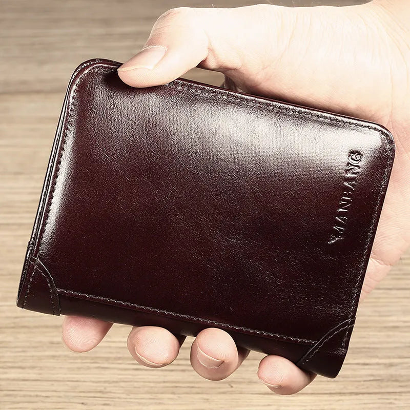 Men's black leather RFID blocking wallet open to show card slots, ID window, and coin pocket.