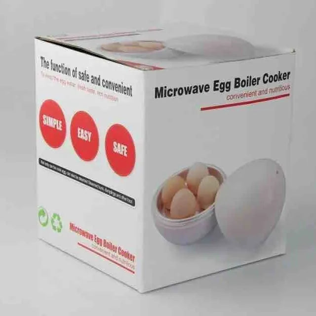 White microwave egg cooker with capacity for four eggs on a kitchen counter.