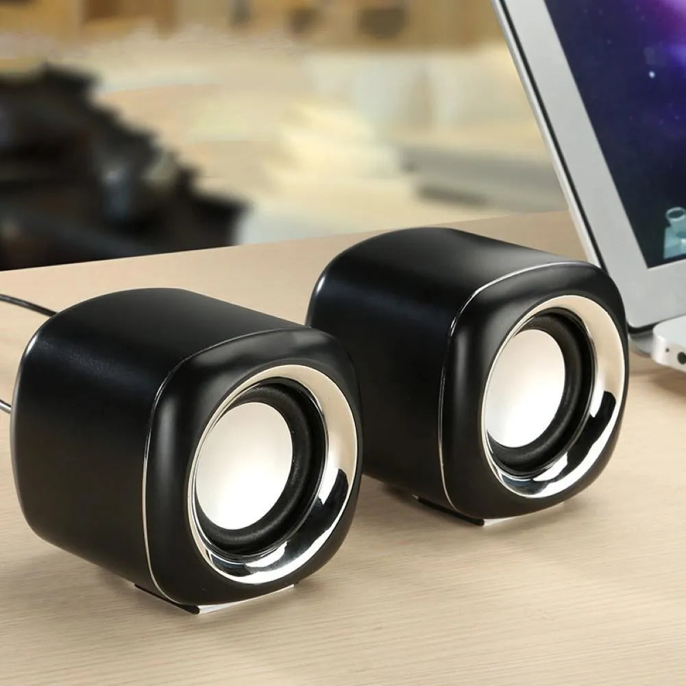 Black and white mini computer speakers with wired 3.5mm connection for desktop audio enhancement