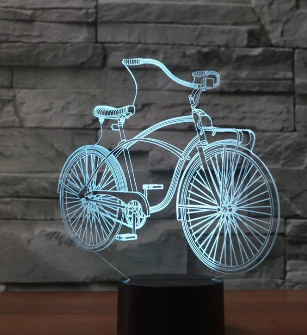 3D bicycle night light with LED acrylic shade on black base against a dark background