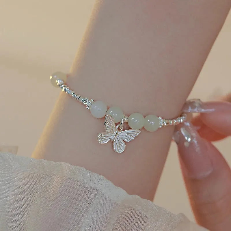 Women's butterfly jewellery set with bracelet and necklace featuring silver electroplated finish and Hetian jade details