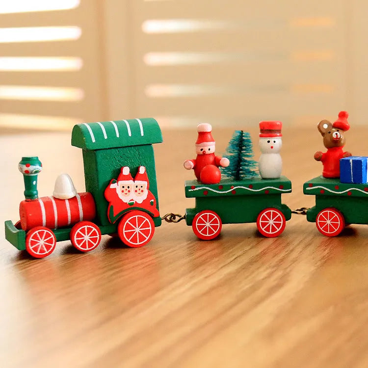 Set of four mini wood train toys in red white and green with painted passengers for shelf display