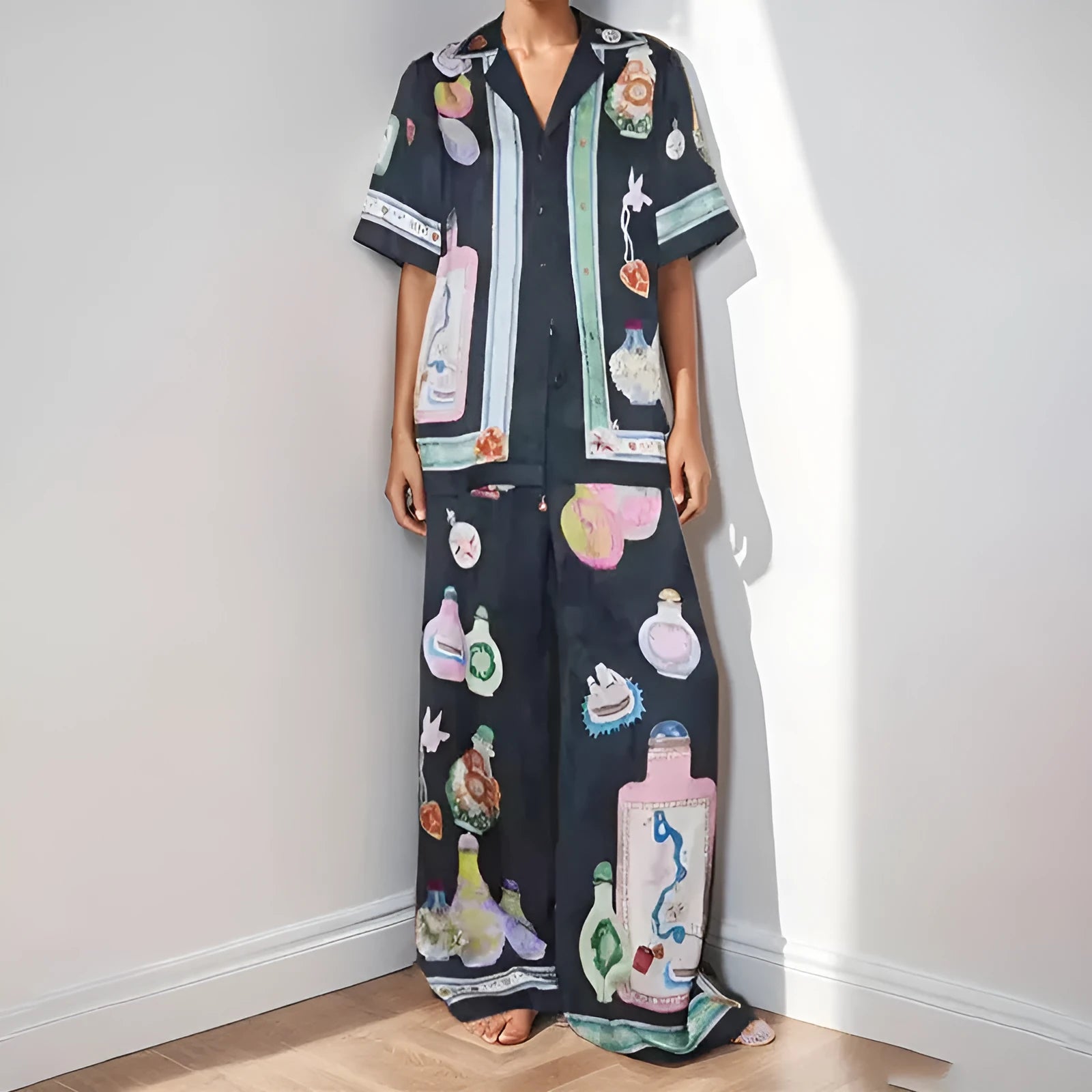 Black women's cardigan and trouser set with cartoon animation print