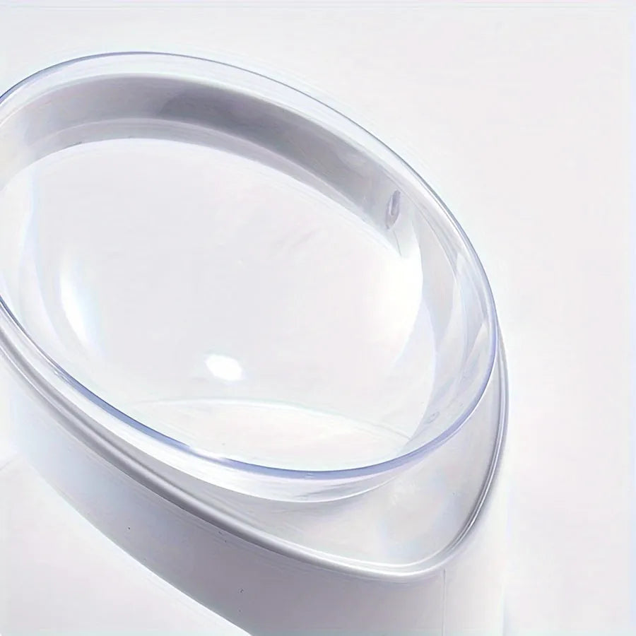 White elevated cat food bowl with a tilted surface on a raised platform.