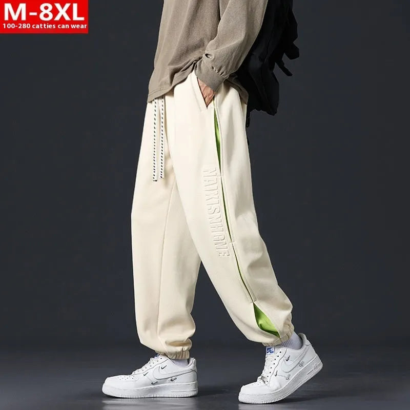 Men's cotton pants with ankle banded design and stitching details in black colour