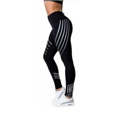 Women's black high-waisted workout leggings with night glowing print pattern on legs