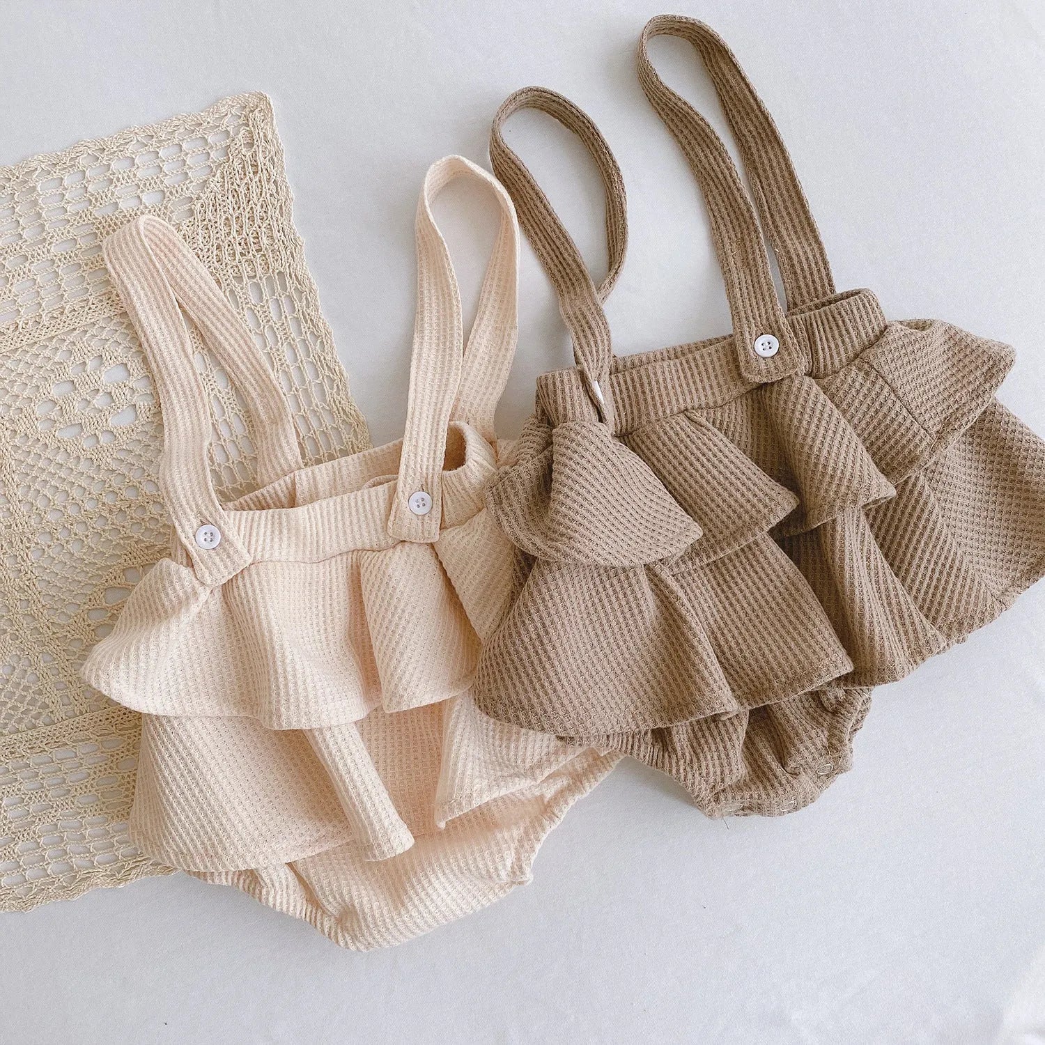 Baby romper climber suit with triangle design and pleated lotus leaf sling in cotton fabric
