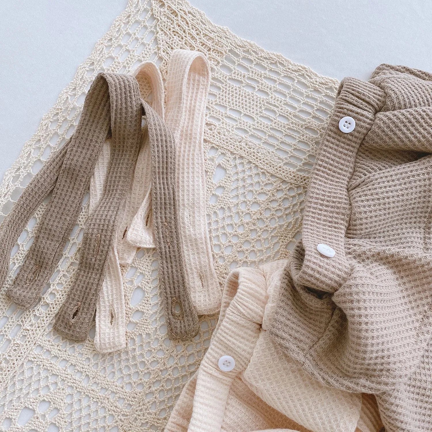 Baby romper climber suit with triangle design and pleated lotus leaf sling in cotton fabric