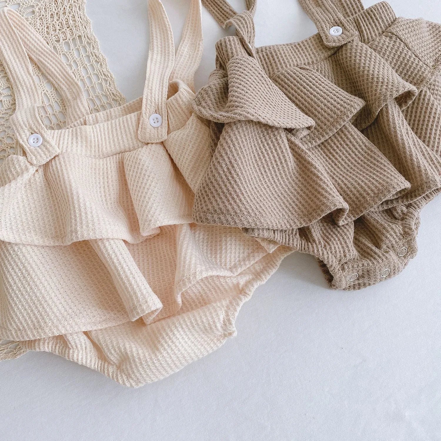 Baby romper climber suit with triangle design and pleated lotus leaf sling in cotton fabric