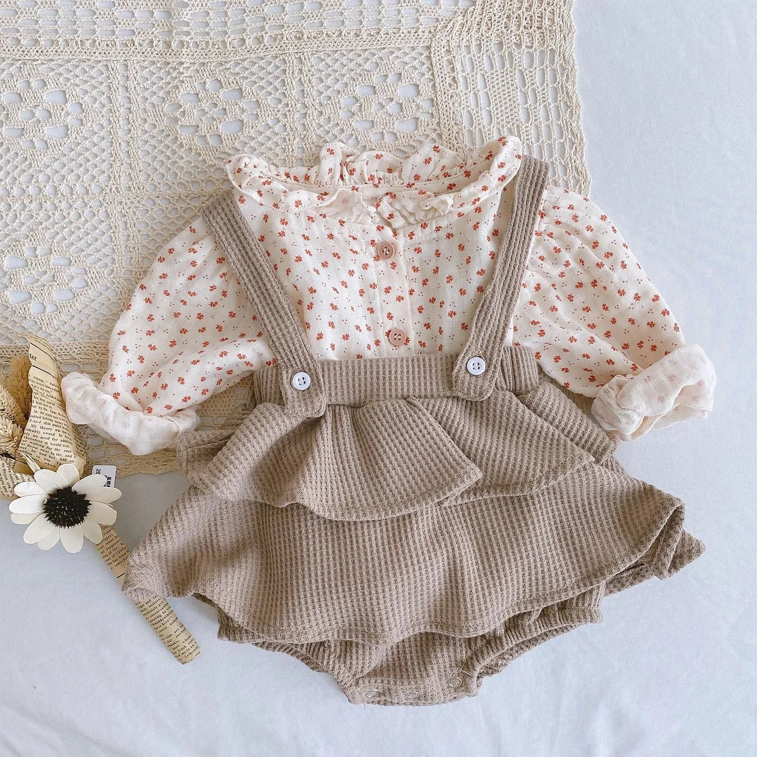 Baby romper climber suit with triangle design and pleated lotus leaf sling in cotton fabric