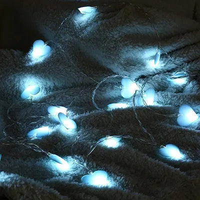 Pink and purple LED fairy string lights with heart and star shapes for bedroom decoration