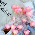 Pink and purple LED fairy string lights with heart and star shapes for bedroom decoration
