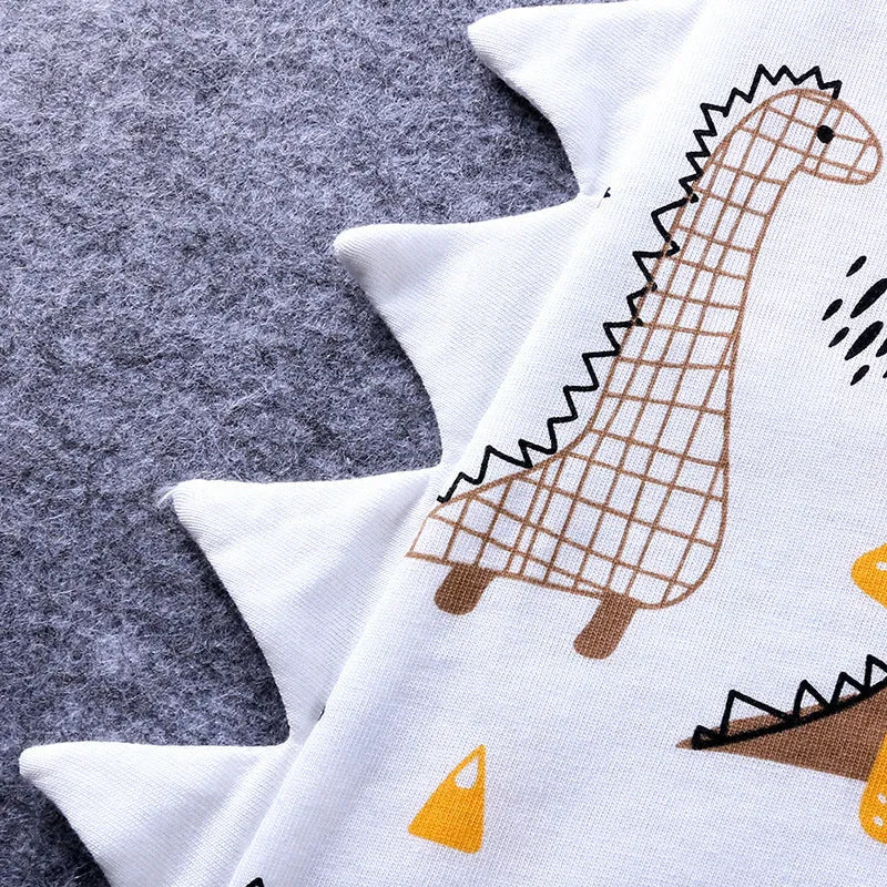 Cartoon dinosaur print short-sleeved cotton baby romper in white and blue, suitable for summer, sizes 66-90 cm