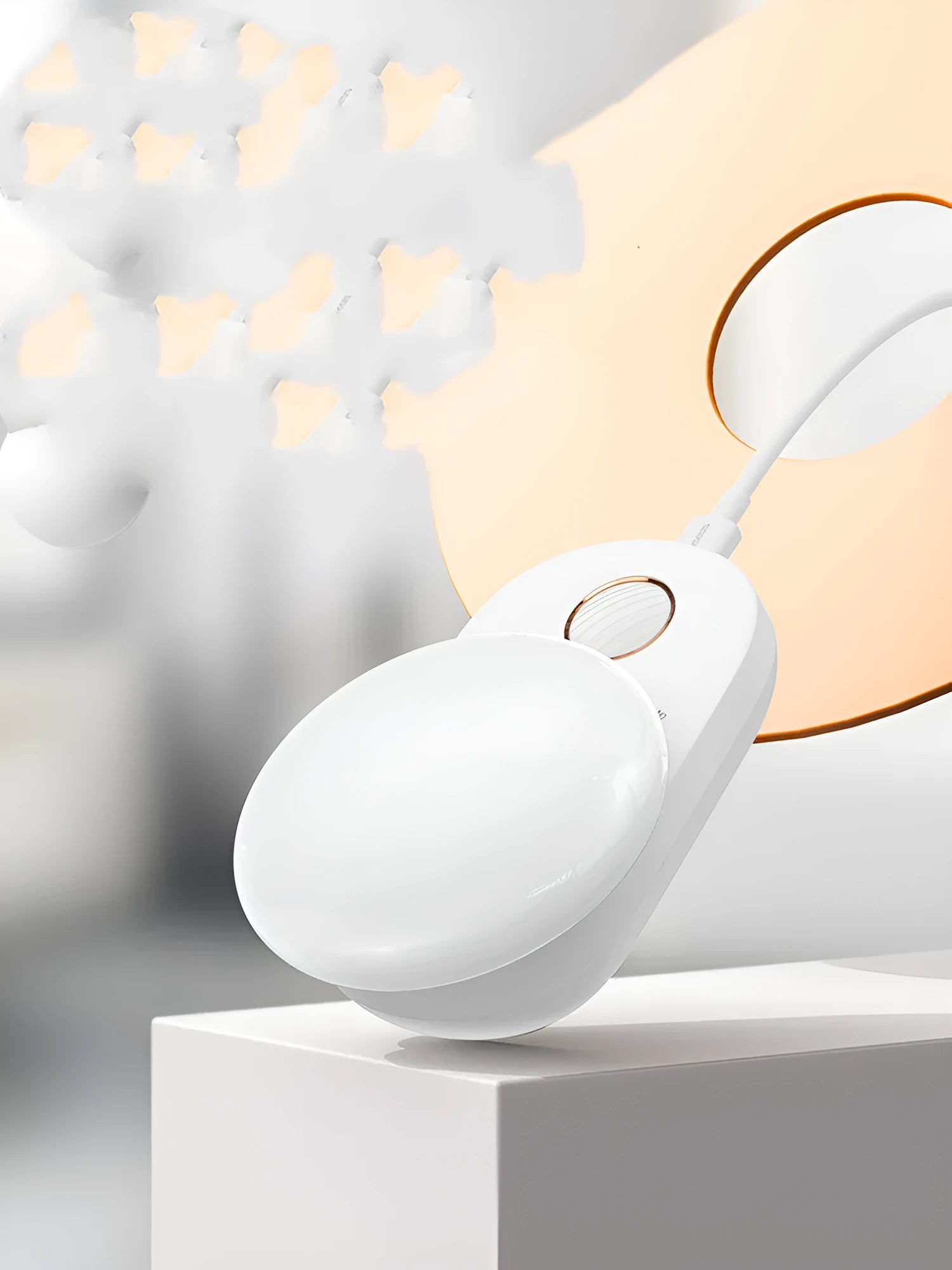 White Baseus rechargeable motion sensor night light on a bedside table.