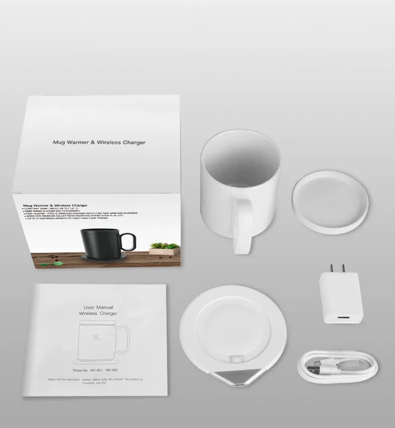 Black wireless charging warm cup on desk next to smartphone, showing USB cable.