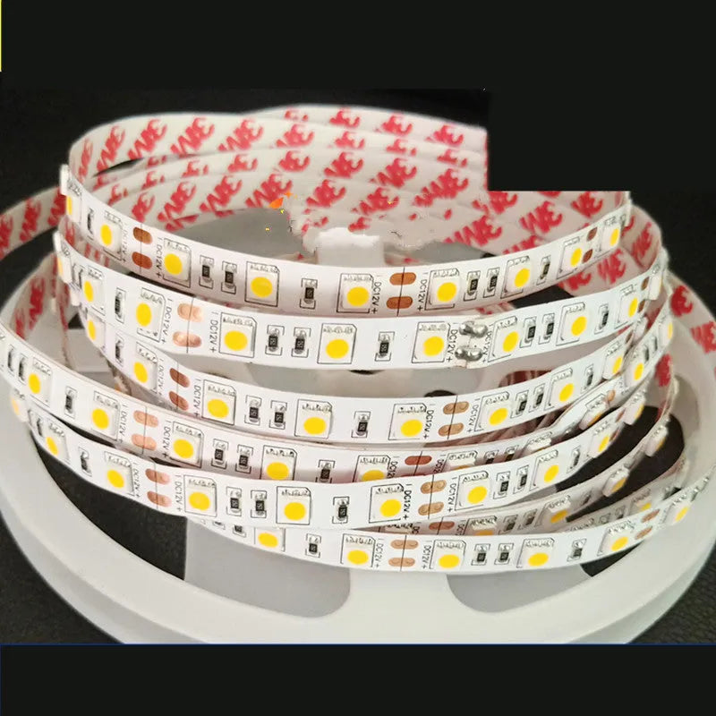 Close-up of a flexible white 12V LED light strip with either 2835 or 5050 chips, designed for shelf lighting.