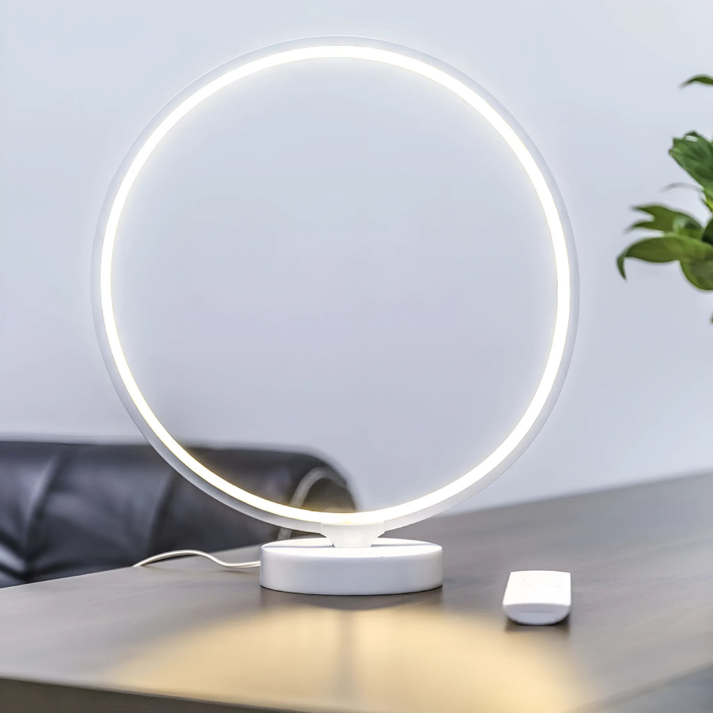 White full moon lamp with remote control on table showing adjustable colour temperature settings