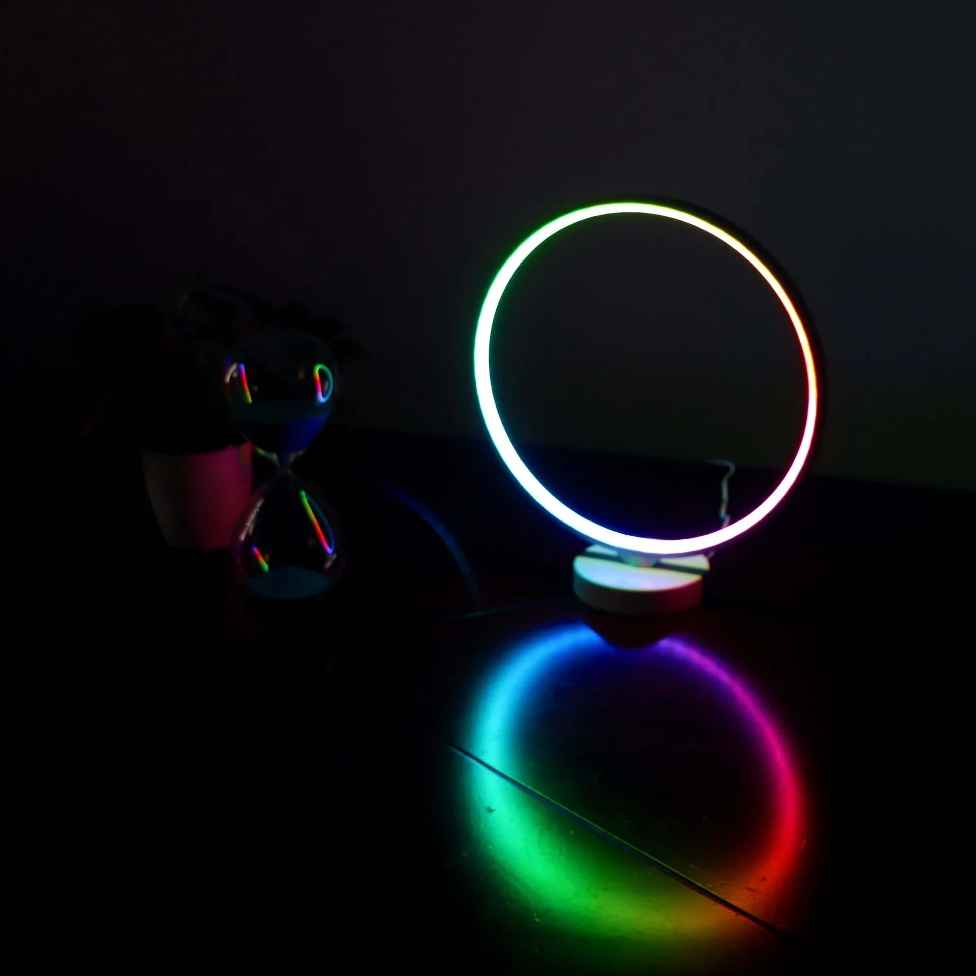 White full moon lamp with remote control on table showing adjustable colour temperature settings