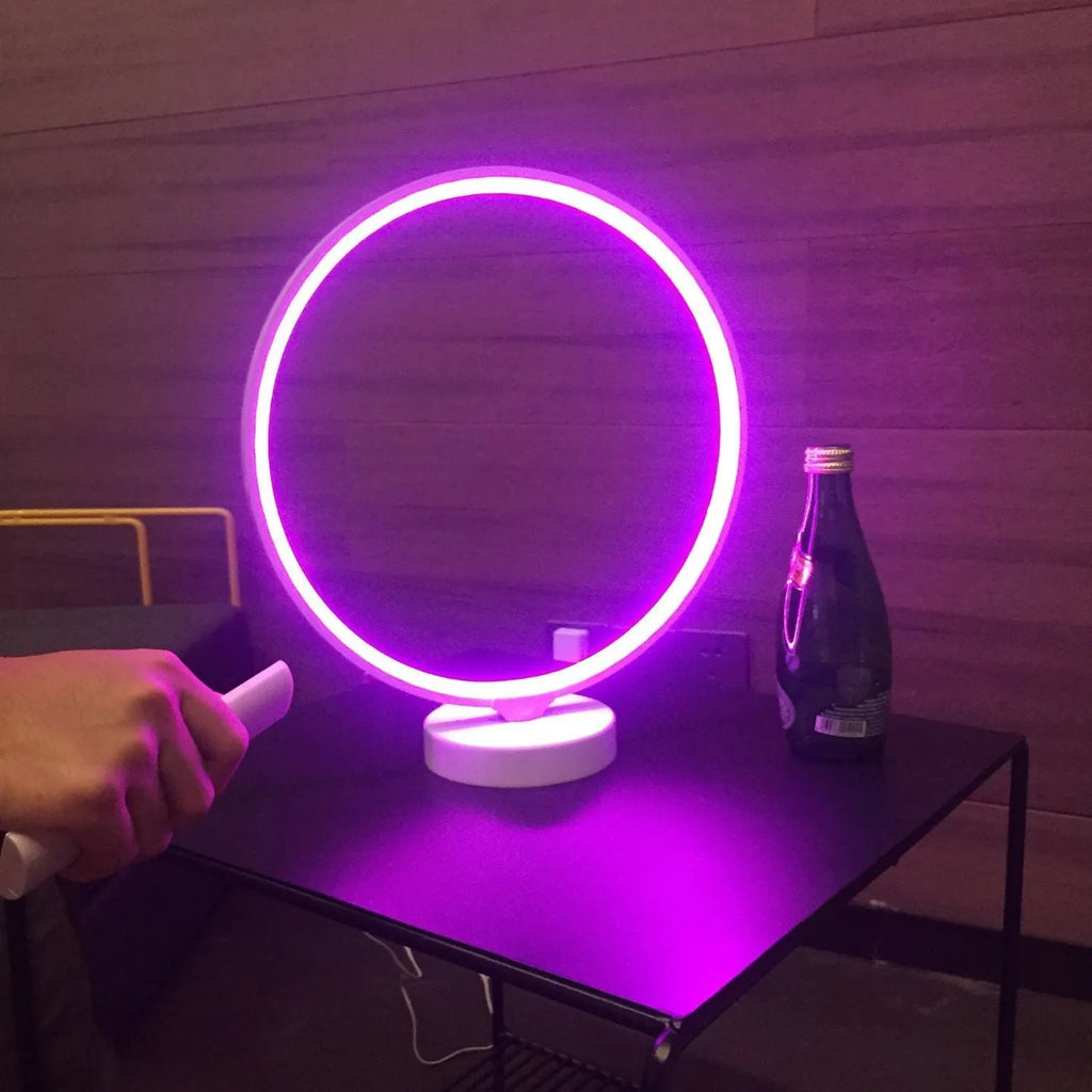White full moon lamp with remote control on table showing adjustable colour temperature settings