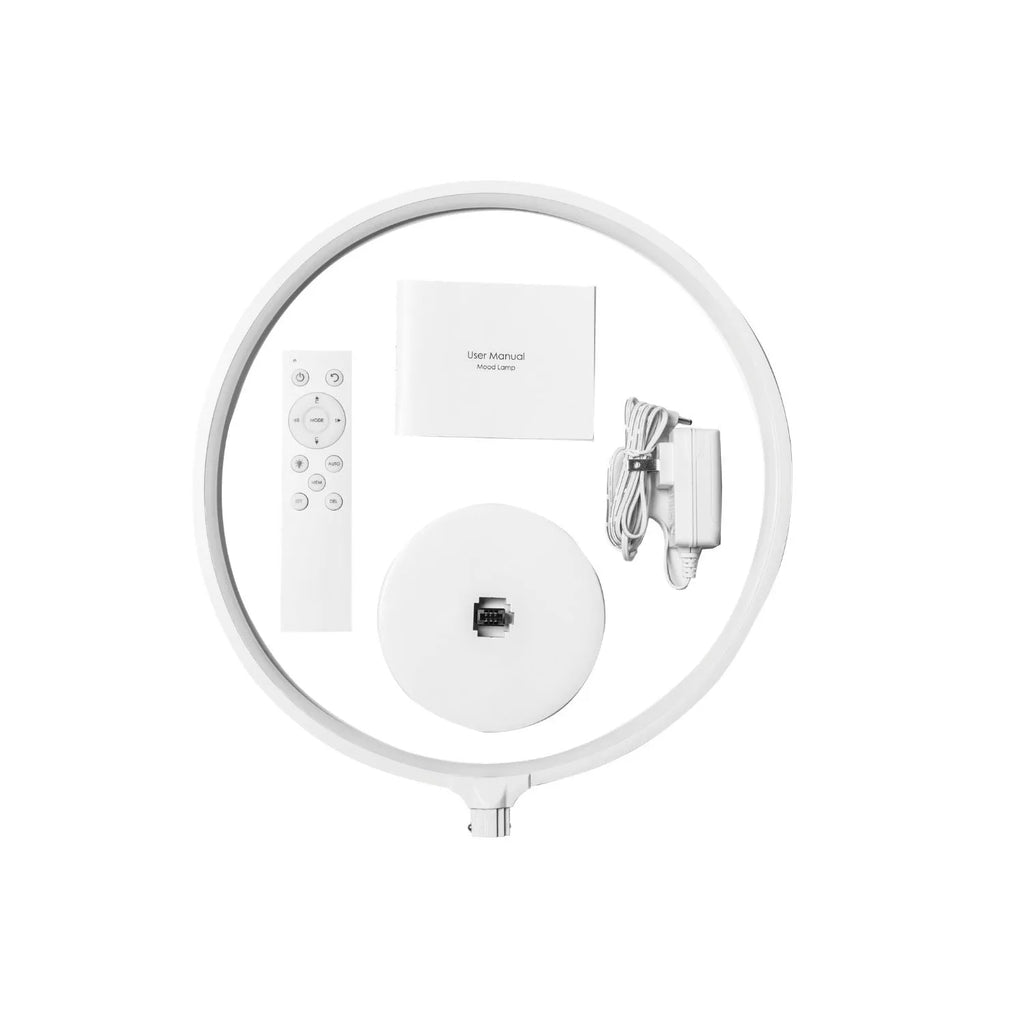 White full moon lamp with remote control on table showing adjustable colour temperature settings