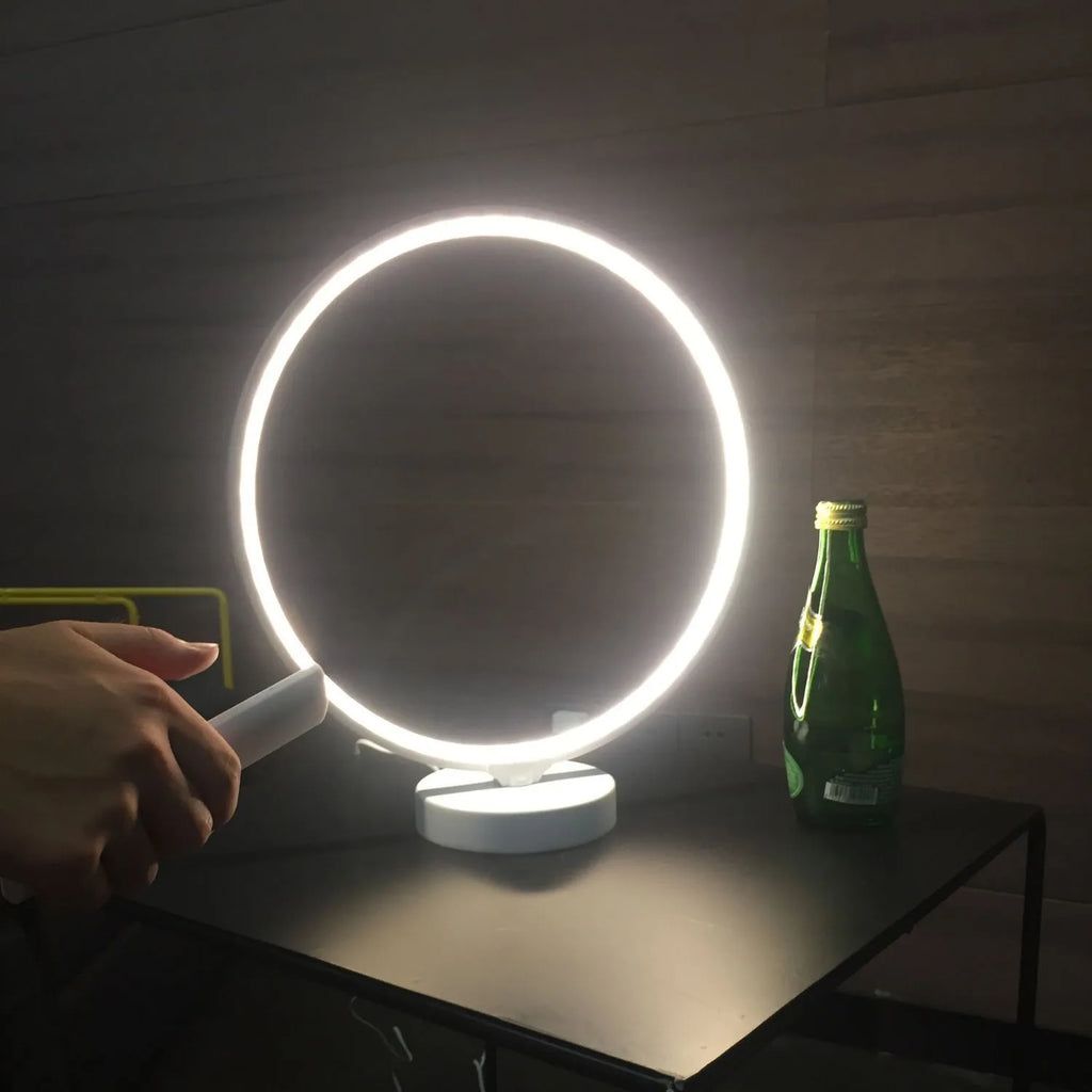 White full moon lamp with remote control on table showing adjustable colour temperature settings