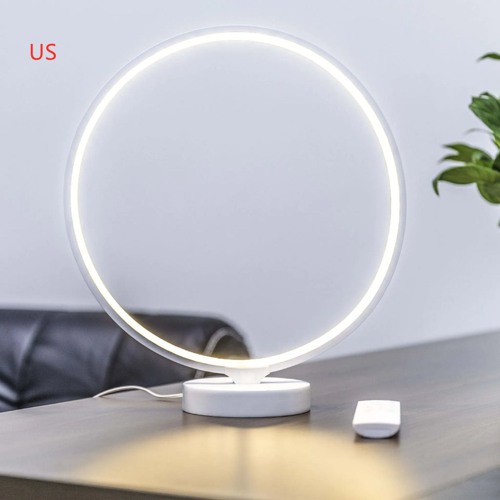 White full moon lamp with remote control on table showing adjustable colour temperature settings