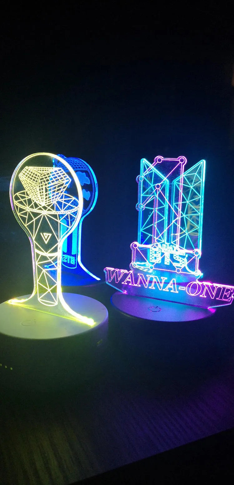 Transparent acrylic display stand showing illuminated BTS Light 101 Tower Gem collectible lamp.