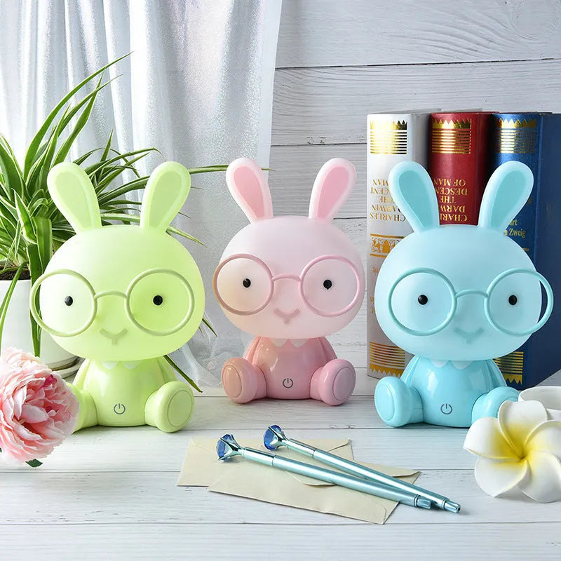 USB-powered cartoon rabbit night light with glasses, available in blue, green, and pink colours