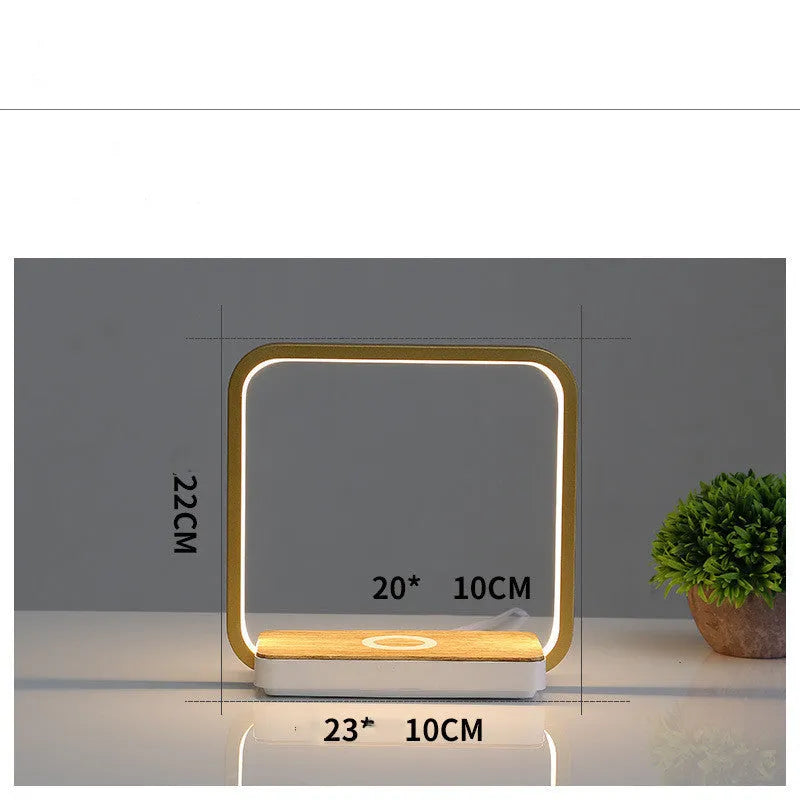Modern white or gold aluminium smart bedside lamp with voice control and USB cable.