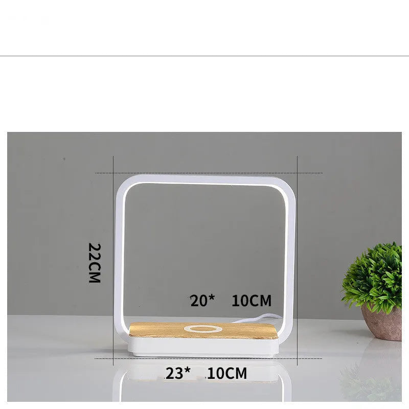 Modern white or gold aluminium smart bedside lamp with voice control and USB cable.