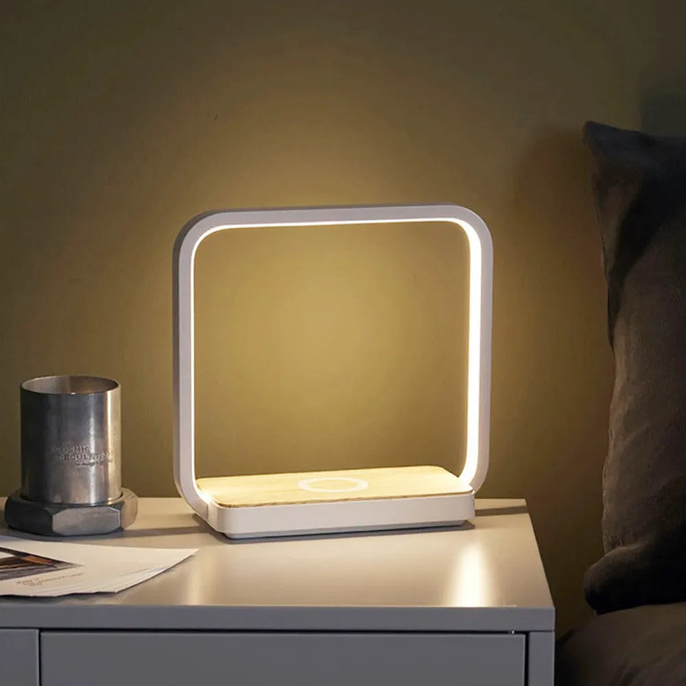 Modern white or gold aluminium smart bedside lamp with voice control and USB cable.