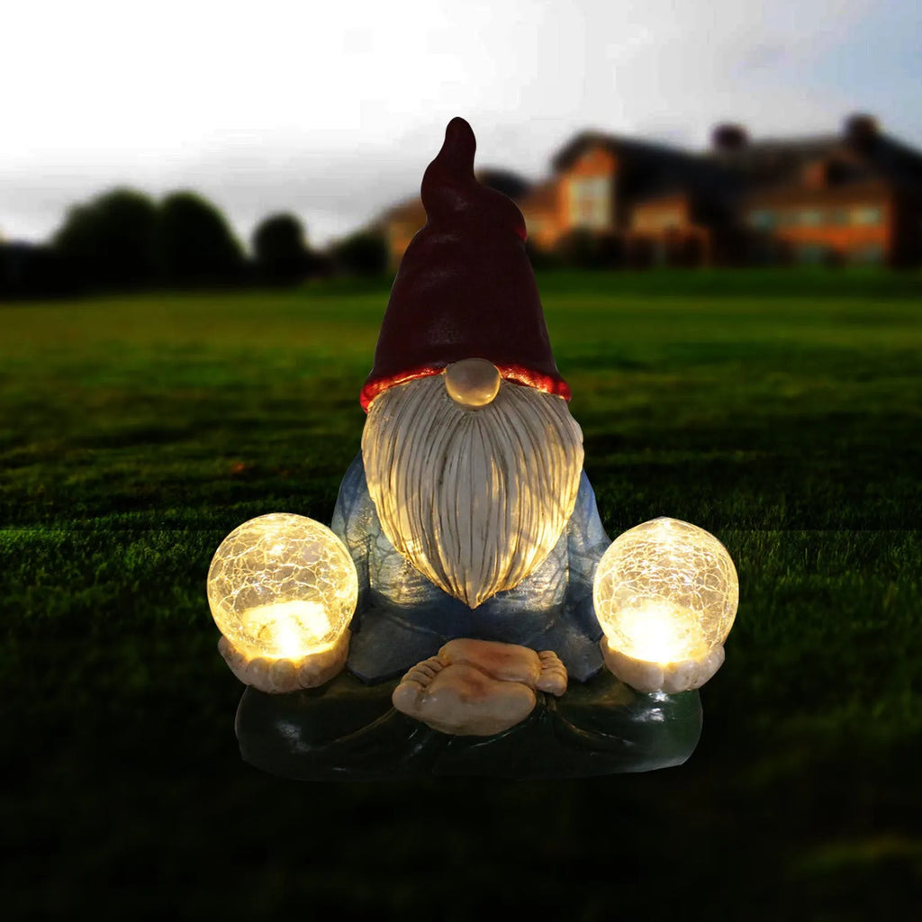 Solar LED resin dwarf doll garden ornament with faceless old man design, shown outdoors.