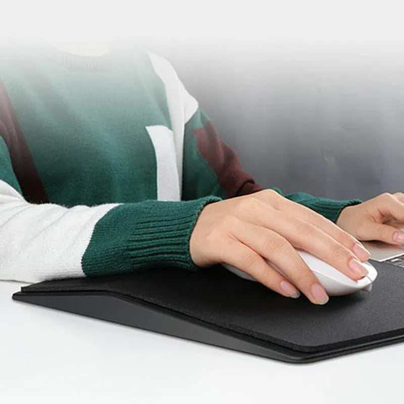 Black three-dimensional geometric mouse pad with honeycomb support structure, 35.8x21x2.8cm, on a desk