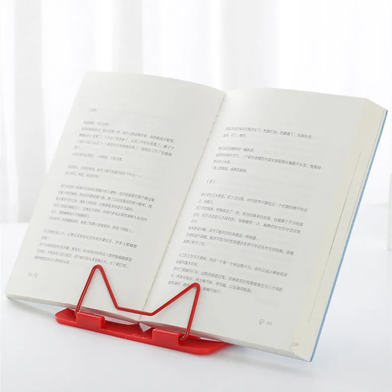 Red, green, and blue metal and plastic reading frame book stand measuring 16 by 17.5 cm