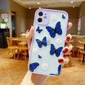 Clear acrylic iPhone case with soft edges showing butterfly design in light blue colour
