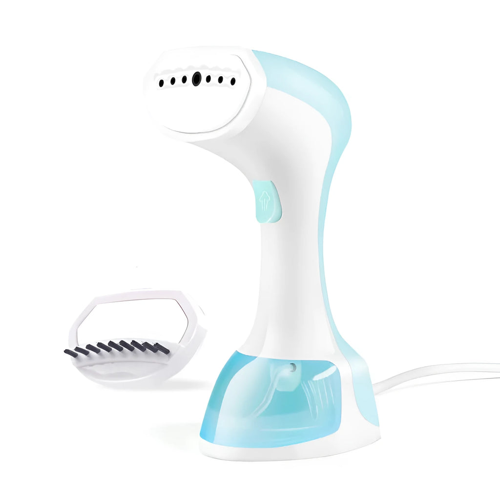 Mini portable handheld garment steamer 1200W in pink with water tank and brush on a wooden surface