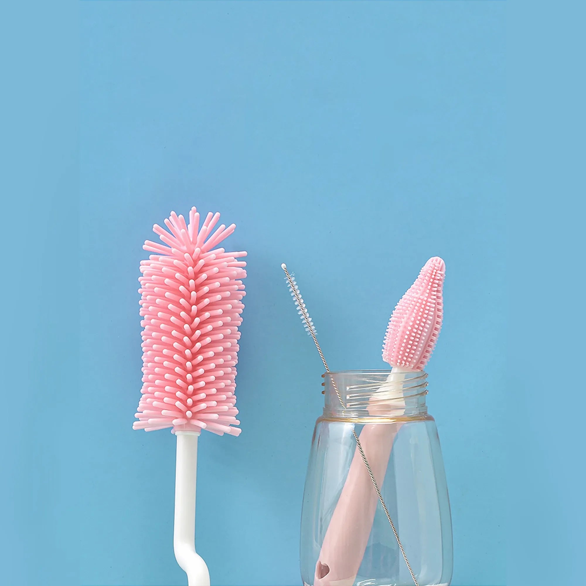 Baby silicone bottle brush set in pink, blue, and yellow for cleaning straws and nipples