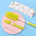 Baby silicone bottle brush set in pink, blue, and yellow for cleaning straws and nipples