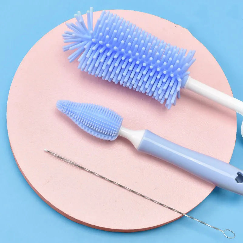 Baby silicone bottle brush set in pink, blue, and yellow for cleaning straws and nipples