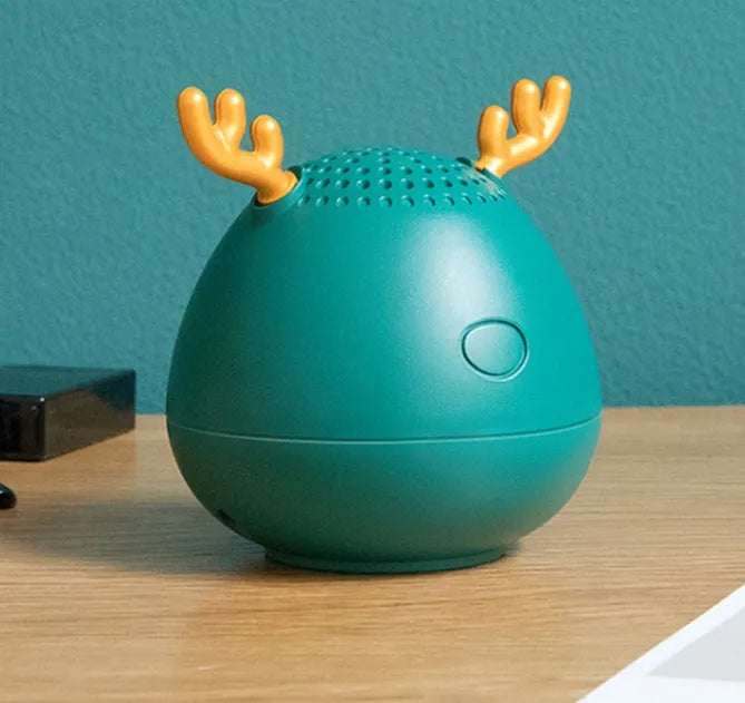Compact Bluetooth wireless speaker with USB port, available in green, pink or white colours