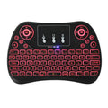 Mini wireless keyboard with multi-colour backlit keys on English layout.