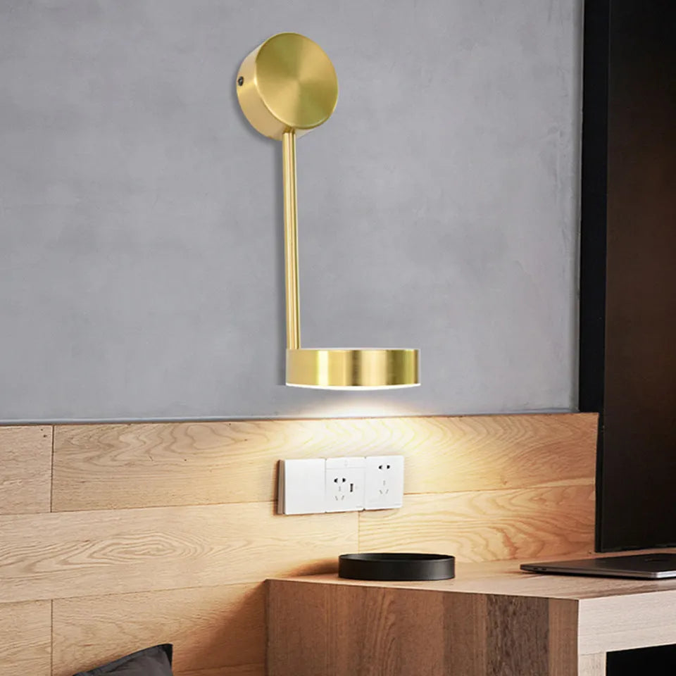 Golden square LED wall lamp with acrylic shade mounted on a wall