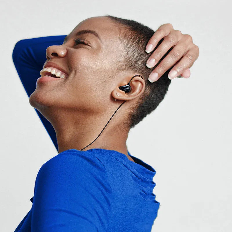 White in-ear sports earphones with black around-ear cable design and 3.5mm plug