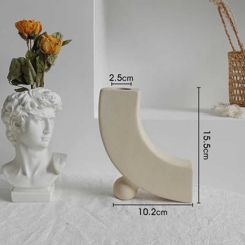 Unglazed matte ceramic dry flower vase with textured surface in Nordic style